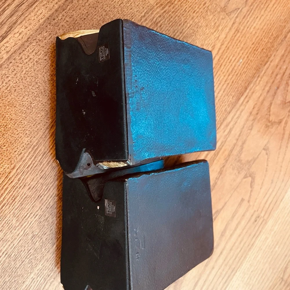 A pair of metal books bookends